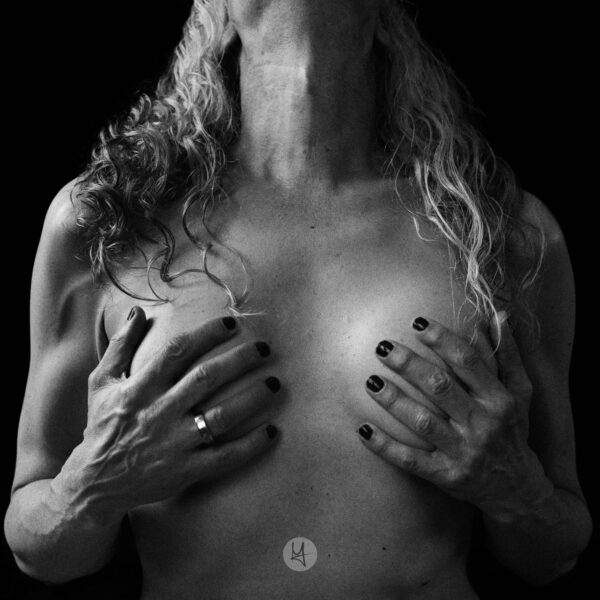 Self-Portrait in black and white. My upper body with my hands holding my breasts.